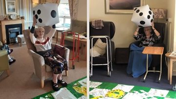 Camelon care home Residents enjoy game of snakes and ladders during games afternoon